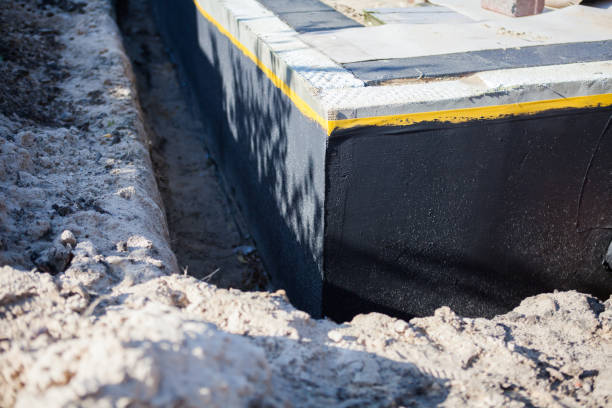 Professional Basement Waterproofing technician working in Bellville, OH